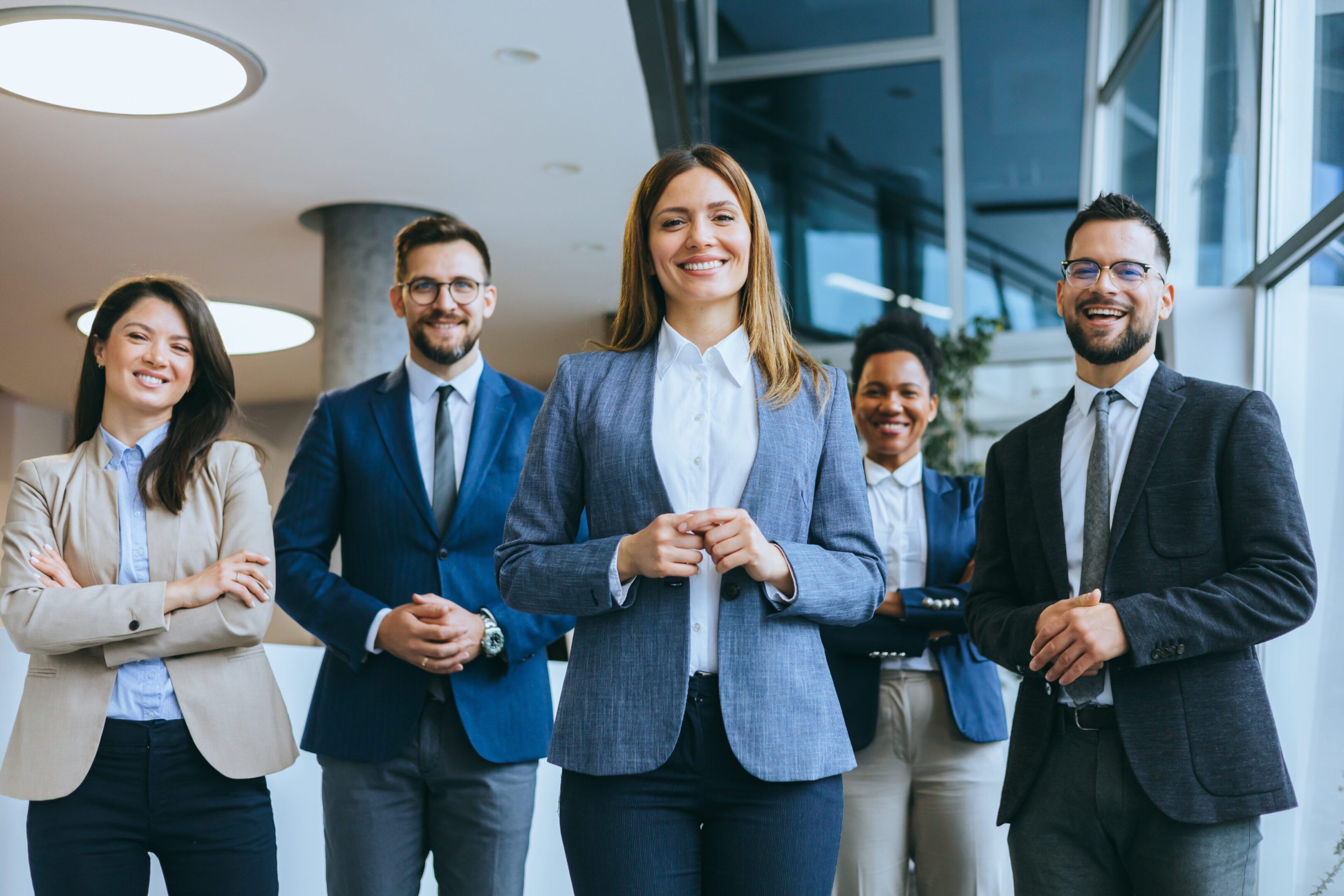 Group of professionals smiling in office.